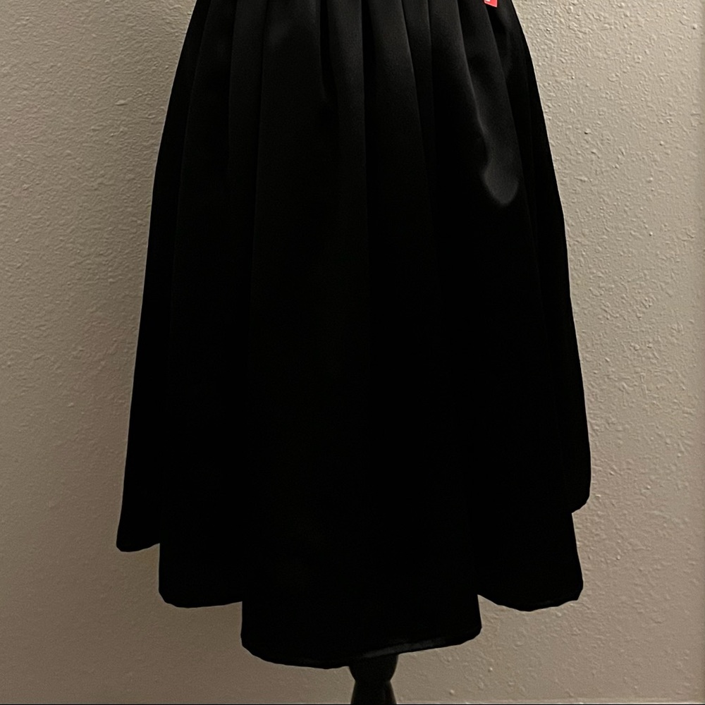 Black satin back crepe full skirt.